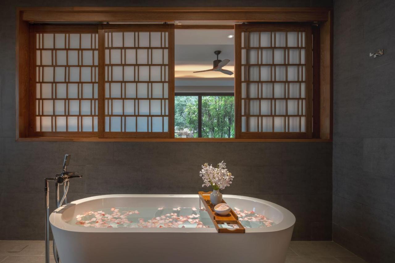 Noku Phuket Hotel Chalong Bagian luar foto A modern freestanding bathtub