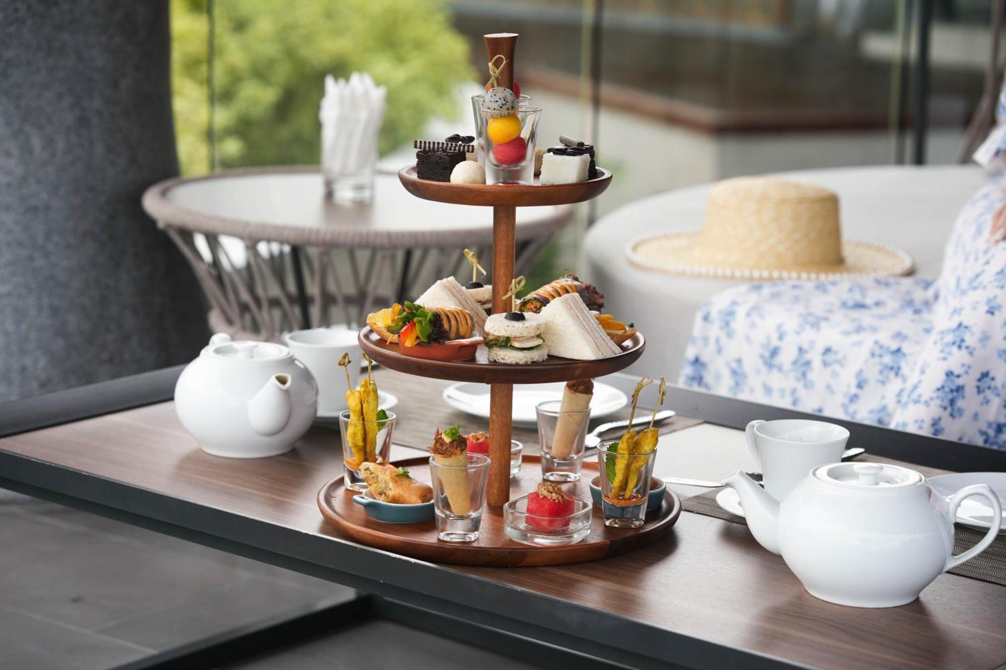 Noku Phuket Hotel Chalong Bagian luar foto Afternoon tea at the InterContinental Sanctuary Cove Resort, Queensland, Australia