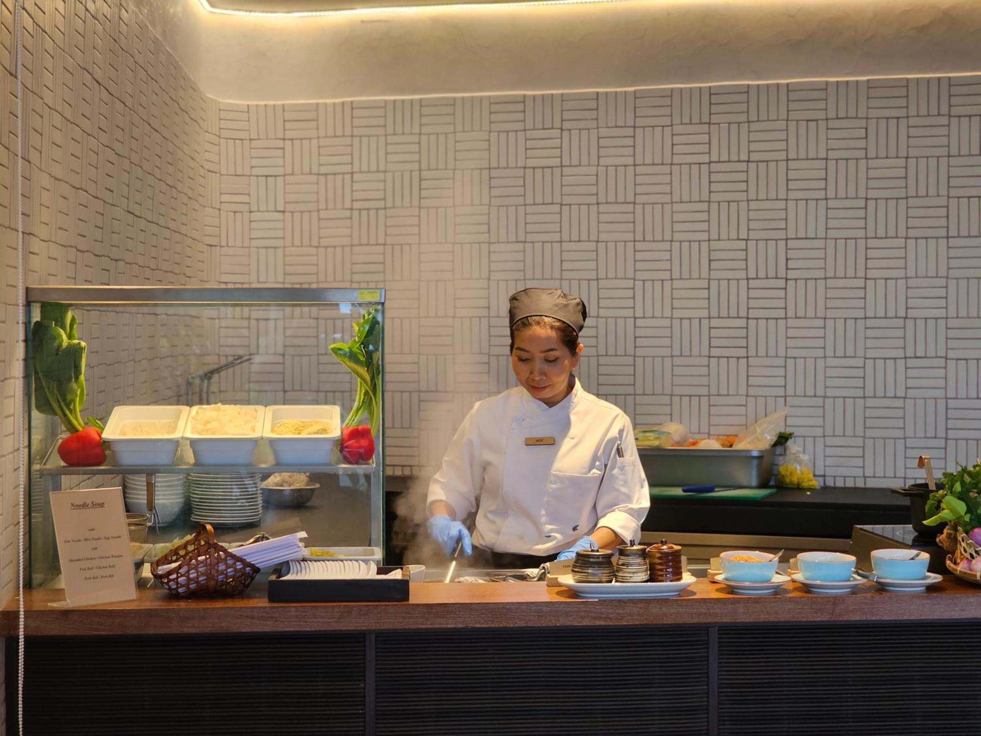 Noku Phuket Hotel Chalong Bagian luar foto A chef at work