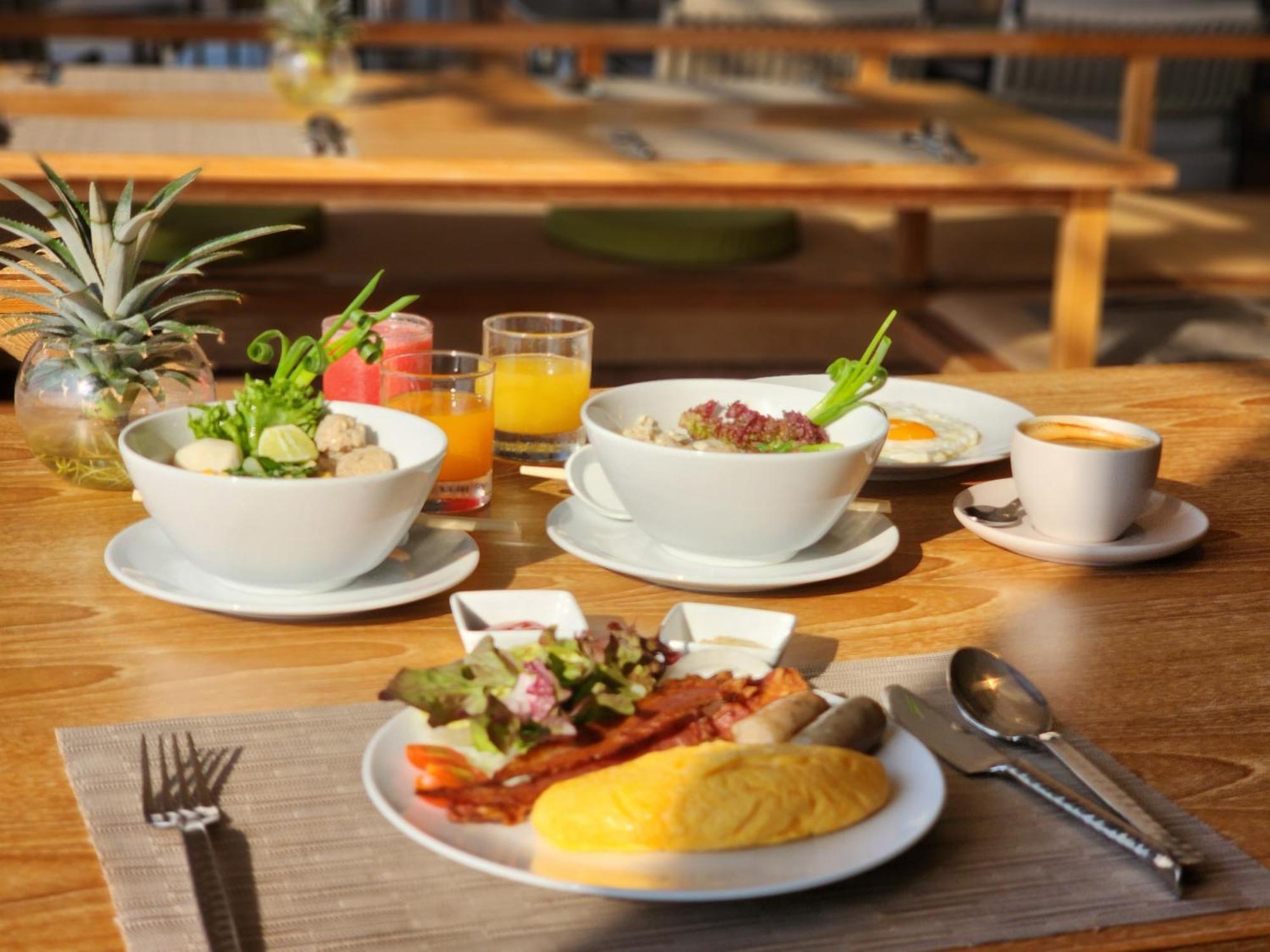 Noku Phuket Hotel Chalong Bagian luar foto A breakfast at the restaurant