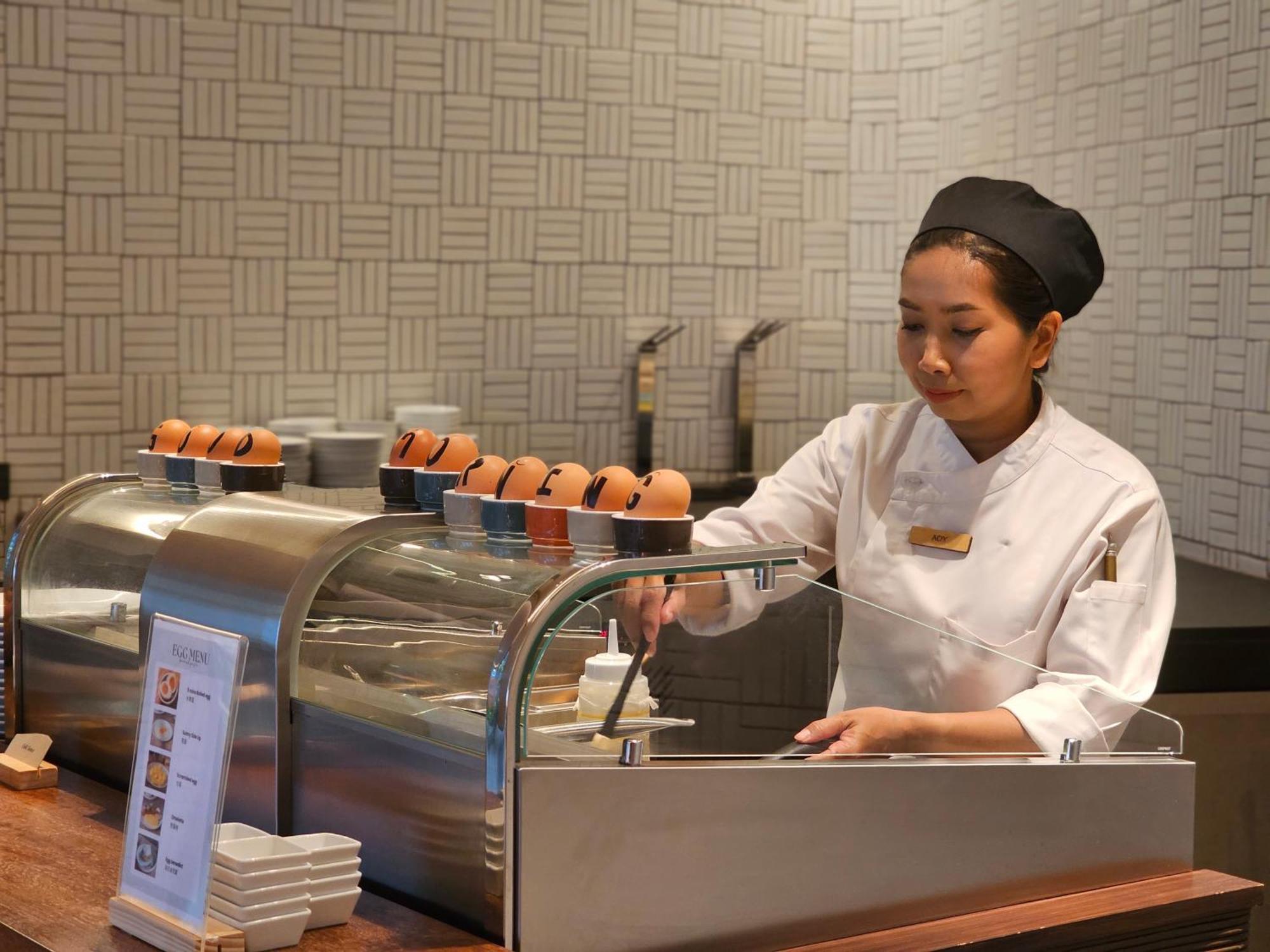Noku Phuket Hotel Chalong Bagian luar foto A chef at work